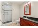 Well-lit bathroom with a glass shower, dark countertops, and modern fixtures create a spa-like experience at 4525 Dean Martin Dr # 2800, Las Vegas, NV 89103