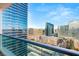 Stunning city view from a high-rise balcony with modern glass railings and clear blue skies above at 4525 Dean Martin Dr # 2800, Las Vegas, NV 89103