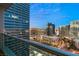 Enjoy city views from this condo's balcony, which features glass railings and a sleek, modern design at 4525 Dean Martin Dr # 2800, Las Vegas, NV 89103