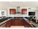 Modern kitchen with stainless steel appliances, dark countertops, sleek backsplash, and a large sink at 4525 Dean Martin Dr # 2800, Las Vegas, NV 89103