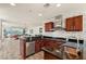 Modern kitchen with stainless steel appliances, dark countertops and sleek backsplash open to living area at 4525 Dean Martin Dr # 2800, Las Vegas, NV 89103
