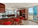 Modern kitchen with stainless steel appliances, dark countertops, breakfast bar, and city views at 4525 Dean Martin Dr # 2800, Las Vegas, NV 89103