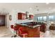 Modern kitchen with stainless steel appliances, dark countertops, breakfast bar, and city views at 4525 Dean Martin Dr # 2800, Las Vegas, NV 89103
