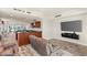 Living room with comfortable seating, large TV, and sliding glass doors showcasing stunning city views at 4525 Dean Martin Dr # 2800, Las Vegas, NV 89103