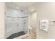 Modern shower with bench, sleek fixtures, and mosaic stone tile floor at 4525 Dean Martin Dr # 2800, Las Vegas, NV 89103