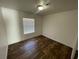 Bedroom featuring wood floors, a neutral color scheme and a bright window at 546 Sheffield Dr, Henderson, NV 89014