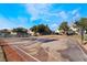 Outdoor community basketball court with trees, and residential buildings in the background at 5961 High Steed St # 103, Henderson, NV 89011