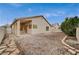 Home exterior with a covered patio and low-maintenance gravel yard and stone border at 612 Bullwhip Ct, Henderson, NV 89011