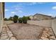 The backyard has gravel landscaping and stone borders, providing a low-maintenance outdoor area at 612 Bullwhip Ct, Henderson, NV 89011