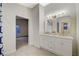 Bathroom features double vanity, gold fixtures, and modern finishes at 612 Bullwhip Ct, Henderson, NV 89011
