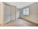 This bedroom is carpeted with a closet and a window at 612 Bullwhip Ct, Henderson, NV 89011