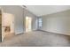 Bedroom boasts neutral carpet and adjoins a bathroom and dining area at 612 Bullwhip Ct, Henderson, NV 89011
