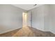 This bedroom is carpeted with a closet and a door to the other rooms at 612 Bullwhip Ct, Henderson, NV 89011