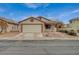 Charming single story home featuring a two-car garage and covered porch at 612 Bullwhip Ct, Henderson, NV 89011