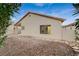 The home's exterior features a low-maintenance backyard with gravel and stone pathways at 612 Bullwhip Ct, Henderson, NV 89011