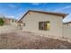 Exterior view of the home highlighting the low-maintenance gravel landscaping with stone border at 612 Bullwhip Ct, Henderson, NV 89011