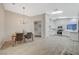 Bright, modern kitchen with white cabinets, stainless steel appliances, and abundant natural light at 612 Bullwhip Ct, Henderson, NV 89011