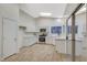 Bright kitchen featuring white cabinets, stainless steel appliances, and a modern design at 612 Bullwhip Ct, Henderson, NV 89011