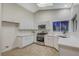 Bright kitchen showcasing white cabinets, stainless appliances, and ample counter space at 612 Bullwhip Ct, Henderson, NV 89011