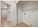 The laundry room has a tile floor and a lot of storage space at 612 Bullwhip Ct, Henderson, NV 89011