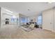 Spacious living area showcasing an open floor plan and access to a white kitchen at 612 Bullwhip Ct, Henderson, NV 89011