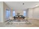 Bright living room features a comfortable sofa, stylish chairs, and decorative rug creating a welcoming atmosphere at 612 Bullwhip Ct, Henderson, NV 89011
