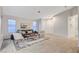 Well-lit living room boasts modern decor and wood-look flooring, creating a clean, inviting space at 612 Bullwhip Ct, Henderson, NV 89011