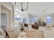 Seamless blend of living, dining, and kitchen areas creates an ideal space for modern living and entertaining at 612 Bullwhip Ct, Henderson, NV 89011