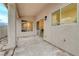 Covered patio with concrete floors, exterior lighting and access to the home's interior at 612 Bullwhip Ct, Henderson, NV 89011