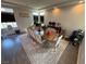 Large dining room with a wood table, seating for ten, and natural light at 7068 Parrot Bay Way, Las Vegas, NV 89118