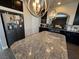 Modern kitchen featuring a large island with granite countertops, and stainless steel appliances at 7068 Parrot Bay Way, Las Vegas, NV 89118
