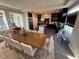 Open concept living room with kitchen, dining area, and modern furnishings at 7068 Parrot Bay Way, Las Vegas, NV 89118