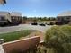 View of the neighborhood street, lawn, and surrounding homes from a mid-level vantage point at 7068 Parrot Bay Way, Las Vegas, NV 89118