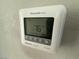 Close up of a Honeywell Home ProSeries smart thermostat on the wall at 7068 Parrot Bay Way, Las Vegas, NV 89118
