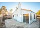 View of a spacious backyard with a concrete patio and stucco exterior at 8072 Big Top Dr, Las Vegas, NV 89123