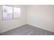 Small bedroom with gray floors and a single window at 8072 Big Top Dr, Las Vegas, NV 89123