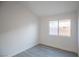 Bedroom featuring a window letting in plenty of natural light and modern flooring at 8072 Big Top Dr, Las Vegas, NV 89123