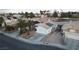 Overhead view of charming homes, desert landscape, and solar panels in quiet neighborhood at 8072 Big Top Dr, Las Vegas, NV 89123