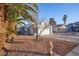 Single-story home showcasing a xeriscape front yard and mature landscaping at 8072 Big Top Dr, Las Vegas, NV 89123