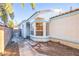 Exterior entrance with large windows, a door with access gate at 8072 Big Top Dr, Las Vegas, NV 89123