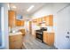 Spacious kitchen has stainless appliances, plenty of cabinets and counter space, and gray floors at 8072 Big Top Dr, Las Vegas, NV 89123