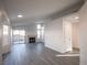 Bright living room with a fireplace, large windows, and modern gray laminate flooring at 8072 Big Top Dr, Las Vegas, NV 89123