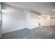 A large, bright living room has been freshly painted and features lovely gray floors at 8072 Big Top Dr, Las Vegas, NV 89123
