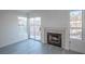 Cozy living room with fireplace, backyard access, and stylish laminate flooring at 8072 Big Top Dr, Las Vegas, NV 89123