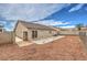 The backyard features low-maintenance landscaping and a block wall for privacy at 904 Melic Way, North Las Vegas, NV 89032