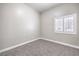 Carpeted bedroom features a bright window at 904 Melic Way, North Las Vegas, NV 89032
