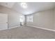 A carpeted bedroom with a closet, bright window and neutral decor at 904 Melic Way, North Las Vegas, NV 89032