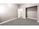 Carpeted bedroom features a walk-in closet and neutral decor at 904 Melic Way, North Las Vegas, NV 89032