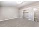 A carpeted bedroom with a walk-in closet and neutral decor at 904 Melic Way, North Las Vegas, NV 89032