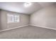A carpeted bedroom with a bright window and neutral decor at 904 Melic Way, North Las Vegas, NV 89032